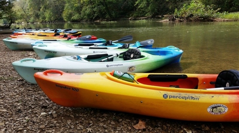 Kayaks on a gravel bar on the river